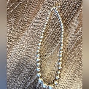 Graduated sterling silver necklace.